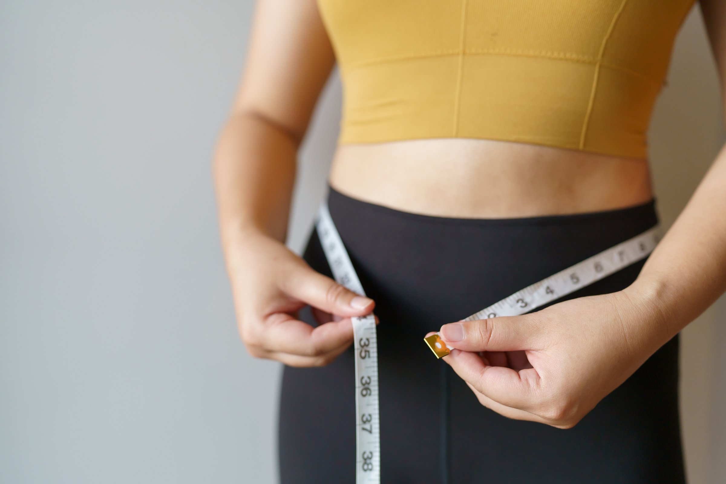 Woman Want to Lose Weight with a Centimeter Shape up Healthy Sto